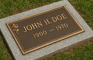 A flat granite grave marker (Flush Marker) after professional care and cleaning