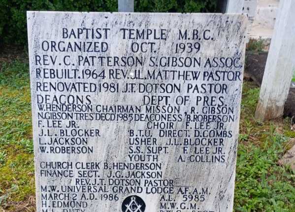 Fully restored and deep-cleaned condition of flush bronze/black granite monument in Louisiana after Tending service