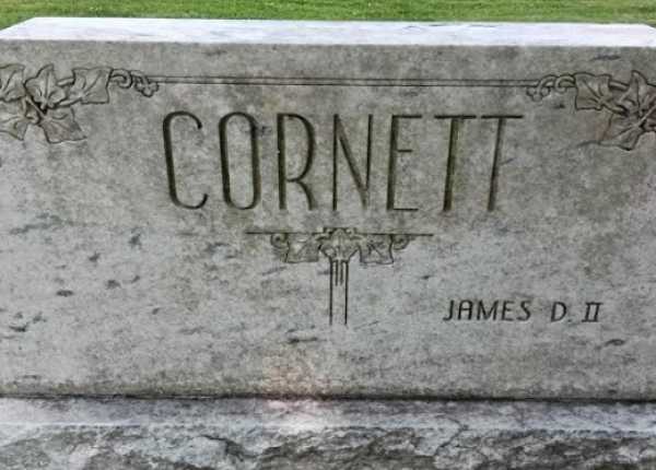 Weathered and uncleaned condition of upright double-sided limestone headstone in Indiana before professional cleaning