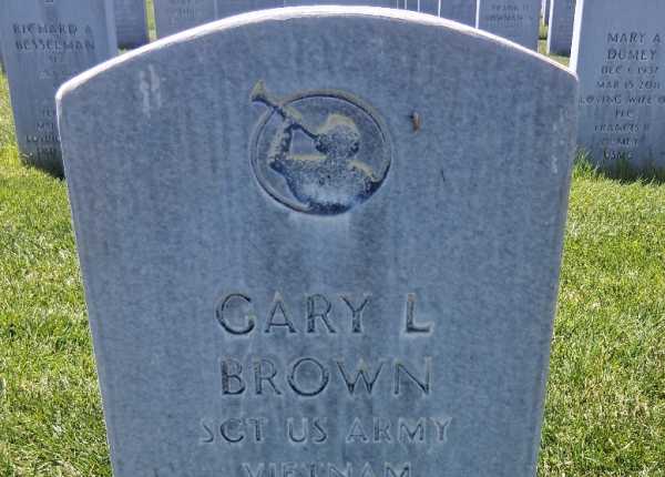 Weathered and uncleaned condition of granite upright monument and concrete bevel marker in Arizona before professional cleaning
