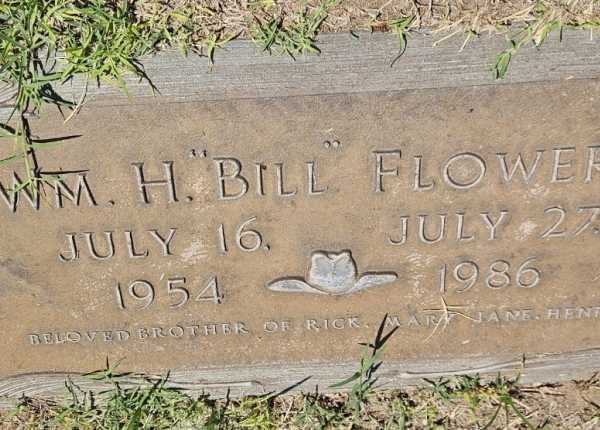 Weathered and uncleaned condition of granite flush marker in Texas before professional cleaning